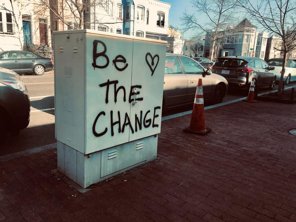 ‘Be the change,’ and a doodled heart is graffitied on city infrastructure.  